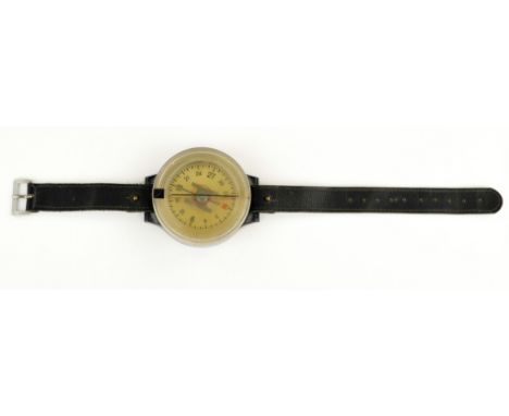 Large, liquid filled, AK 39 German wrist compass, 2.5 in. dia., designed to be worn on a Luftwaffe pilot or crewman's right w