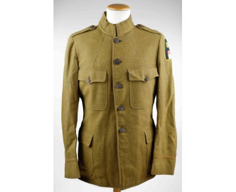 U.S. FIRST ARMY ARTILLERYMAN'S WOOL TUNIC World War I U.S. 1st Army artilleryman's green wool tunic, five flat black-painted 