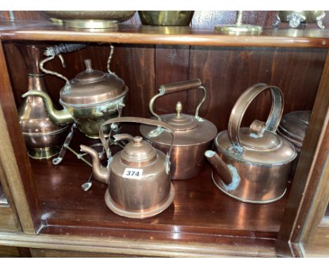 BOTTOM SHELF OF COPPER KETTLES