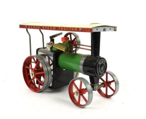 A Mamod precision live steam showman's traction engine in green and red livery, 17cm high. .    