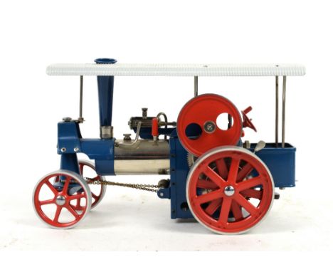 A Wilesco precision live steam traction engine 'Old Smokey' in blue and red livery, 20cm high..    