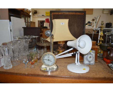A table lamp mounted with a clock', an Angle Poise lamp, sold and collector's item