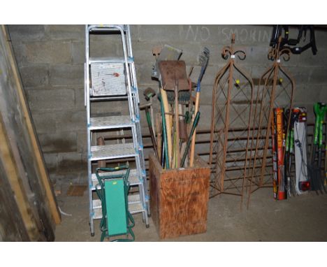 A quantity of long handled gardening tools 