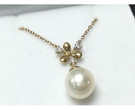 A 9ct yellow gold cultured pearl and diamond icycle design necklace, boxed. R/C diamond 0.10ct