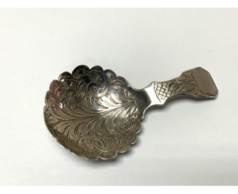 A hallmarked silver caddy spoon, marks for Birmingham 1874. (A)