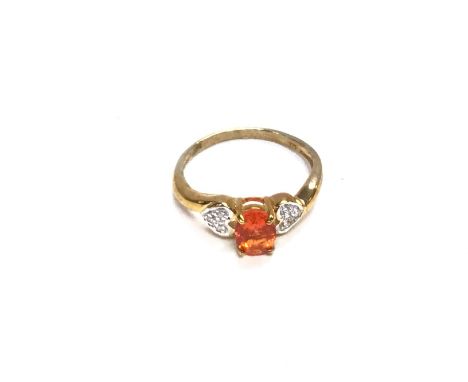 A 9ct gold ring set with central orange stone. Size M and 1.90g Postage A