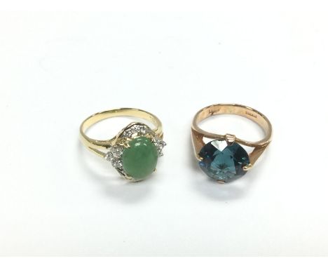 Two gold rings comprising an 18ct gold example with a polished green stone surrounded by small diamonds, size M-N plus a 14k 