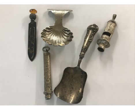 A collection of silver comprising caddy spoons whistle pencil and paper clip.