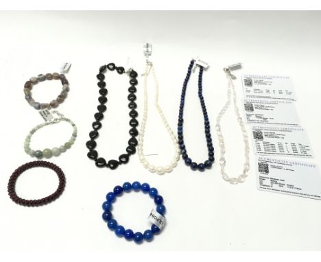 A collection of assorted necklaces and bracelets including jade and obsidian etc. Postage B