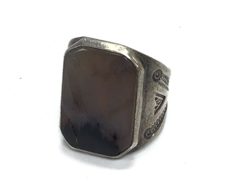 A white metal and agate set ring . Size N/O Postage category A