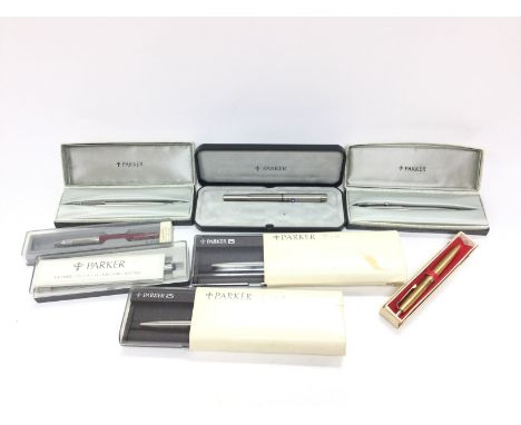 A collection of cased Parker pens and a Scripto pen.