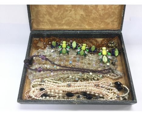 A collection of vintage crystal and real pearl necklaces. Shipping category B.