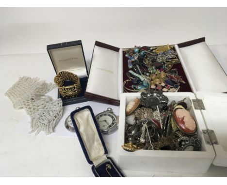A quantity of costume jewellery brooches earrings a designer bracelet and two Chrome button wind pocket watches and oddments.