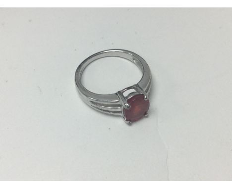A 9ct white gold padparadscha sapphire set ring. Approx 3.72 grams Ring size M.