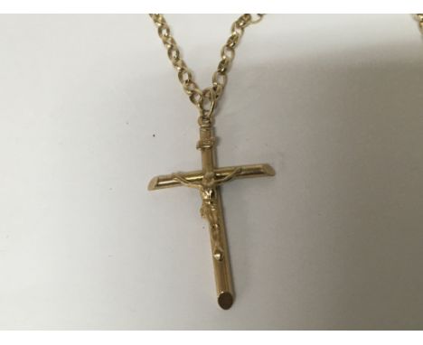 A 9carat gold crucifix with attached 9carat gold belcher chain. Weight 9.5g
