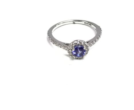 A 9ct diamond and sapphire cluster ring. Size M and 2.1g Postage A