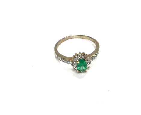 A 9ct gold ring set with green and white stones. Size M and 1.84g Postage A