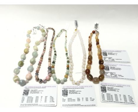 A collection of 5 necklaces all set with various gem stones including Peruvian pink oval and Burmese jade. Postage B