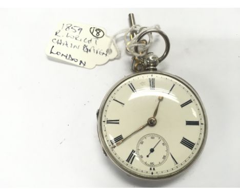 A silver cased pocket watch from 1859. R Wright. Approximately 50mm case. Winds and runs. Postage B