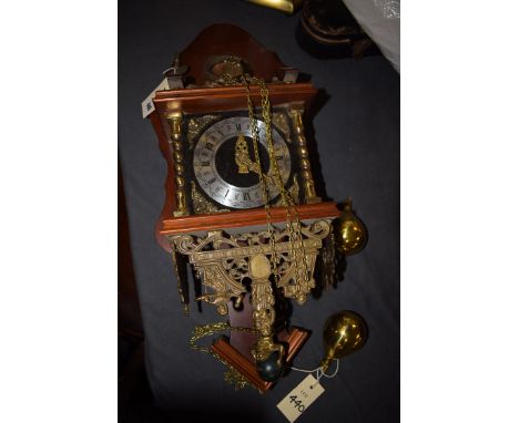 A modern Dutch wall clock in stained mahogany case.
