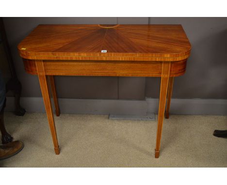 A Sheraton style inlaid mahogany turn-over top card table, the green baize inset top with pull out extending action, 35 3/4in