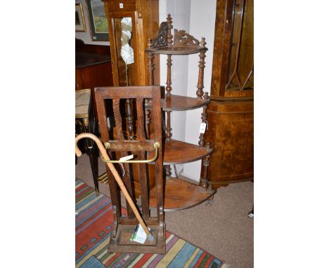 A Victorian four-tier graduating whatnot; together with an oak umbrella receiver, fitted a tray to the base.