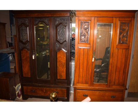 Two late Victorian stained wardrobes, with single bevelled mirror door with drawer below, raised on bracket feet; together wi