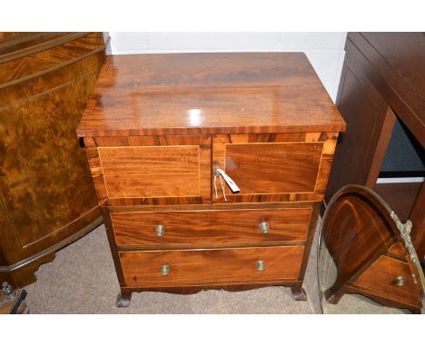 A Georgian mahogany converted commode with two cupboard doors, crossbanded with rosewood, two fitted drawers below, 25in. wid