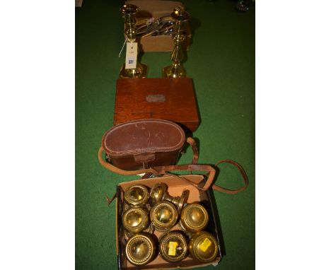 A pair of early 20th Century brass candlesticks; a set of drawing instruments, in fitted mahogany case; a pair of Keiner Wetz
