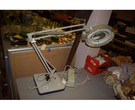 An anglepoise lamp in grey. 