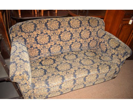 An early 20th Century drop end sofa upholstered in leaf decoration.