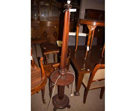A 20th Century mahogany standard lamp.