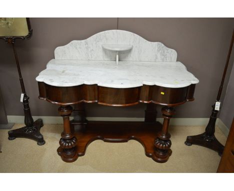 A Victorian marble top mahogany washstand, fitted single frieze drawer, 48 1/2in. wide; together with a matching dressing tab