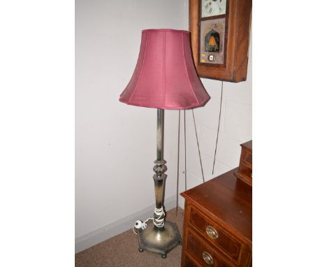 An early 20th Century oxidized pewter coloured standard lamp with bulbous and tapering hexagonal column on hexagonal base.