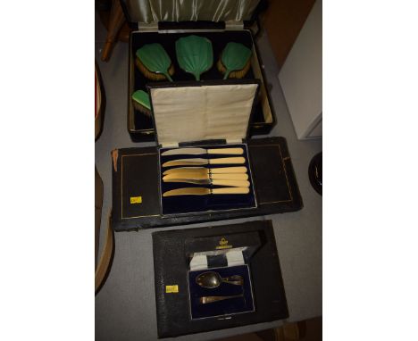 An early 20th Century green enamel dressing table set, comprising: mirror, two hair brushes and two clothes brushes, cased; t