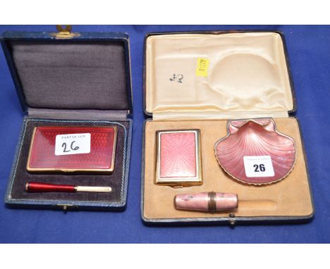 A red enamel cigarette case and cigarette holder, cased; a pink enamel cigarette case and ashtray (cigarette holder missing),