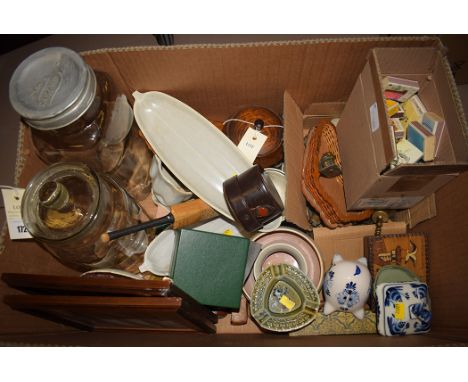 A box of sundries, to include; Poole pottery; old match boxes; a Tudor Crystal paperweight; Needlers Ltd storage jar; a minia
