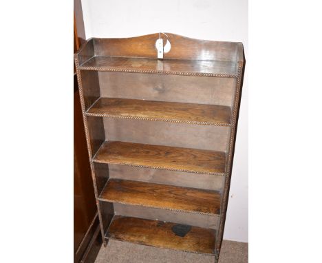 An early 20th Century oak five shelf bookcase with beaded decoration to front and sides, measures 24in. wide.