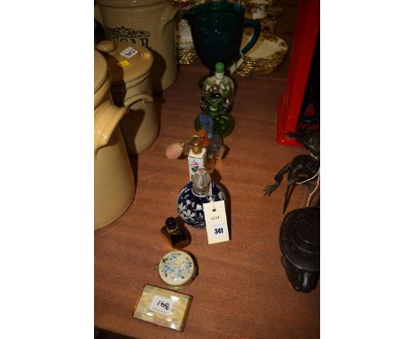 A sterling silver bangle with floral scroll decoration; glass and ceramic scent bottles; a green pressed glass jug; a mother-