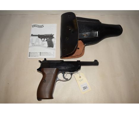 A Walther .177 calibre air pistol, numbered 13B28224, in leather holster, with manual.