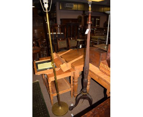 A mid 20th Century brass standard lamp; together with a wooden torchere converted to a standard lamp with reeded and carved c
