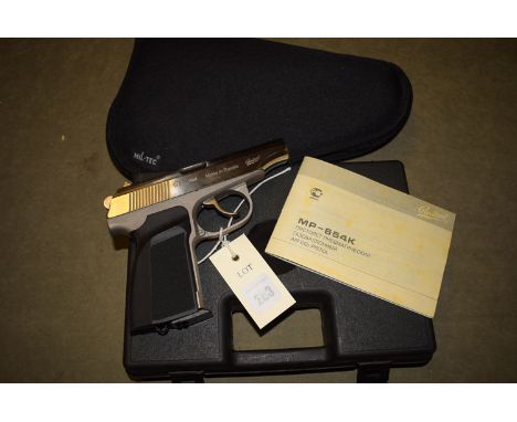 A Baikal Makarov .177 calibre air pistol, numbered T15004685, in black plastic case; and a Mil-Tec canvas holster, with manua