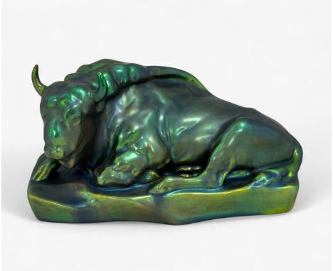 A Zsolnay Bull/ Bison figurine on a rectangular base, with eosin iridescent green glaze. Marked Zsolnay Hungary to base. Leng
