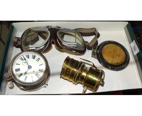 A pair of vintage stadium motorcycle goggles marked BS4110X Stad, an Ansonia car clock, a 1926 tax disc in metal holder and a