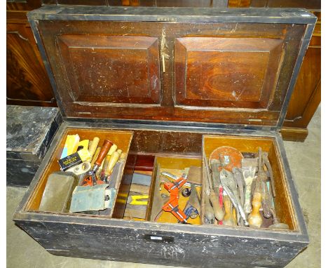 A large painted wooden tool chest, 97cm wide, 51cm high, 45cm deep, together with a collection of carpentry and other tools. 