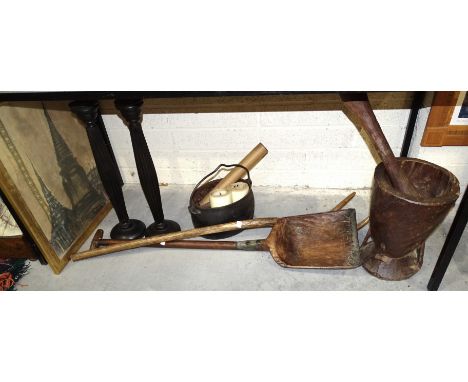 A rustic-made wooden shovel, a two-prong pitch fork, a carved wood pestle and mortar, (mortar 37cm high, 27cm diameter) and o