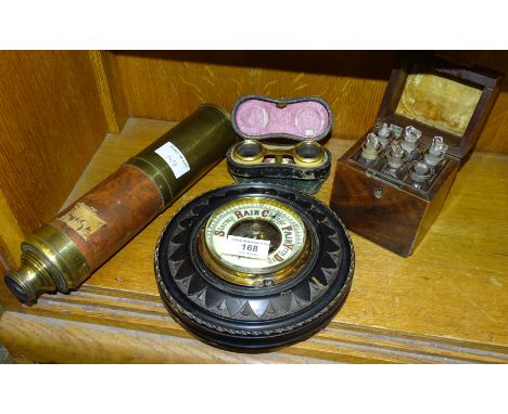 A brass three-draw telescope, (a/f), an aneroid barometer, a pair of opera glasses and a 19th century mahogany small six-divi