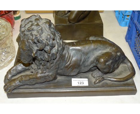 R Moll, a contemporary bronzed cold-cast resin sculpture of a recumbent lion, 31cm long, 18cm high, signed R Moll, 115/750 to