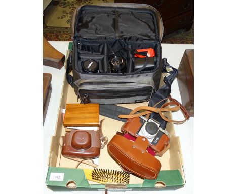 A Minolta X-300 camera and accessories, in case, a Praktica camera, a Halina 35X camera and a small collection of LP and 45RP