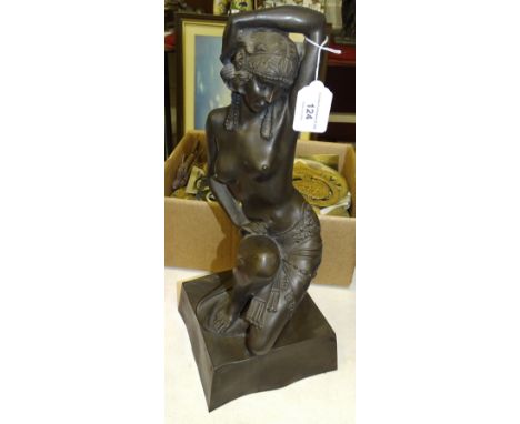 Unsigned, a contemporary bronzed cold-cast resin sculpture of a semi-naked female figure, kneeling on one leg and wearing a s